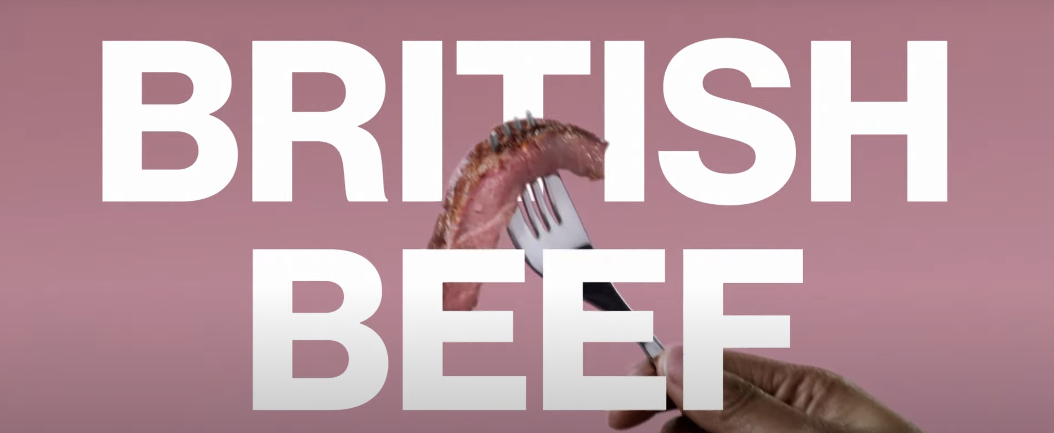 Text "British Beef" and a piece of meat on a fork